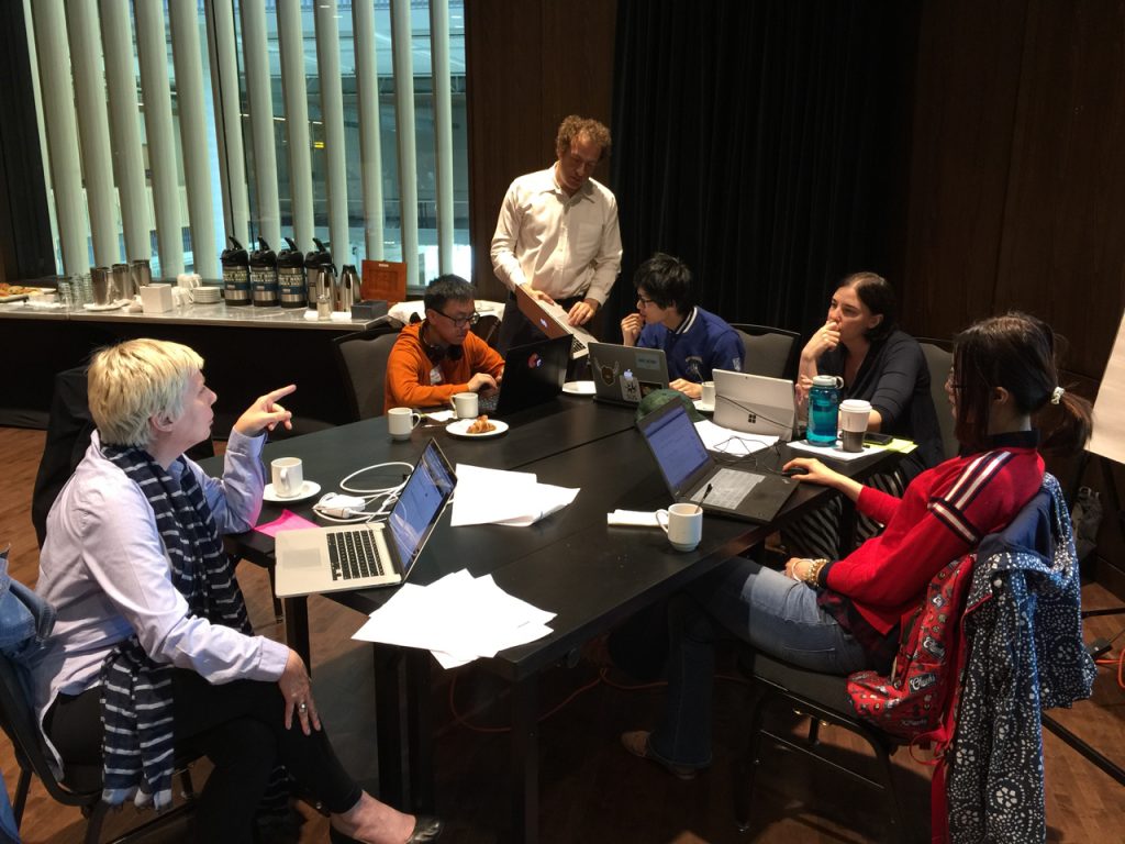 Students working with Erin Fields (near blue bottle), Lucas Wright (standing), and Cindy Underhill (blonde hair)