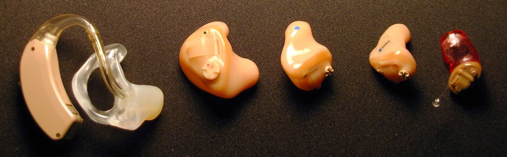 Hearing aid advancements. Old -> New.              Source: Wikimedia Commons.