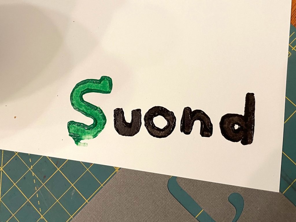 potato stamp print of the word sound, misspelled