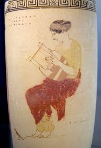 Muse playing the lyre. The rock on which she is seated bears the inscription ΗΛΙΚΟΝ / Hēlikon. Attic white-ground lekythos, 440–430 BC. Staatliche Antikensammlungen, Munich. (Wikipedia)