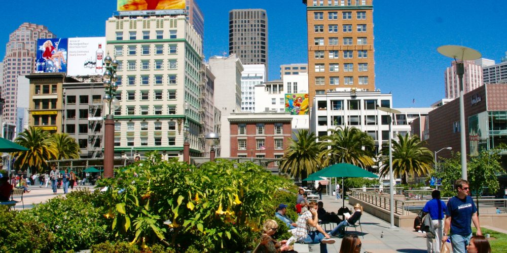People sitting in Union Square Park in San Francisco on a sunny day