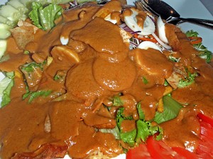 the Salathai house salad with eggs, lettuce and tomatoes slathered in a peanut sauce dressing