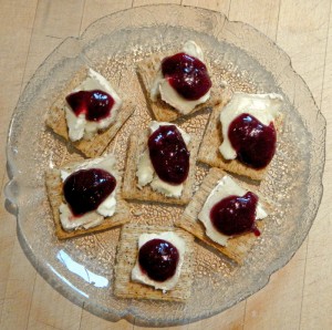 plum butter & goat cheese on Cracked Black Pepper Triscuits