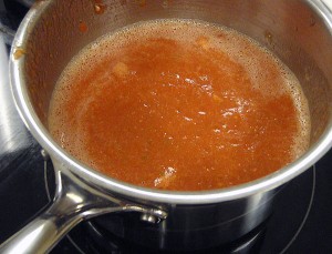 the salsa roja goes into a pot after being blended, and is simmered until cooked