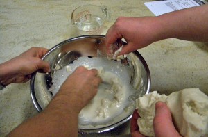 the corn flour is mixed with water to form a dough; the dough is then mixed with more flour to act as a thickener