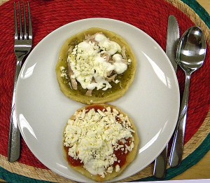 two types of picaditas, one with salsa verde and one with salsa roja