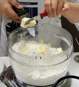 cutting the butter into the flour for the pie pastry