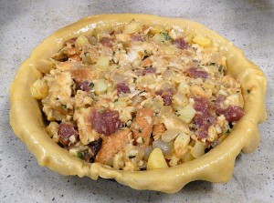 the pork mixture in put into the pastry-lined pie plate