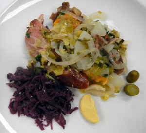 Baeckenofe with sweet and sour cabbage, Dijon mustard and cornichons