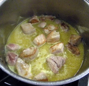 the cubed pork is cooked in orange juice