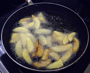 frying the cut-up plantains