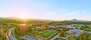 Aerial view of UBC Okanagan campus and surrounding area at sunset on a sunny July day.