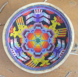 The peyote is represented in the centre of this bowl with the corn and deer around the edges.