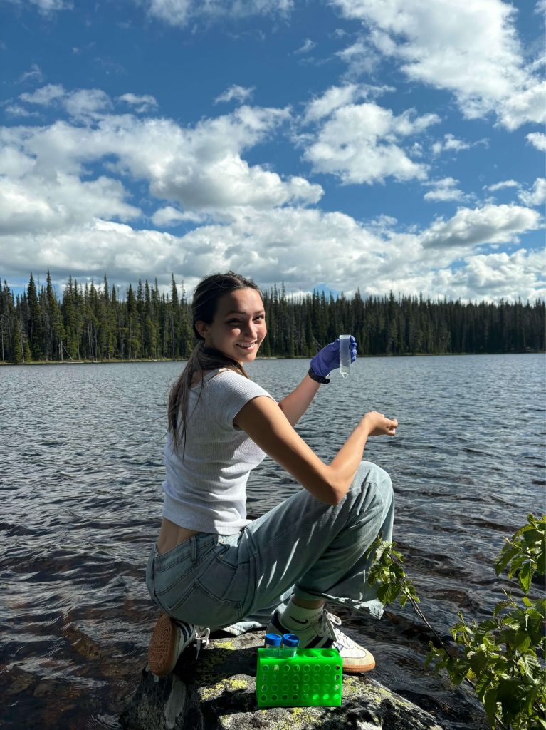 Chloë collecting samples in the field