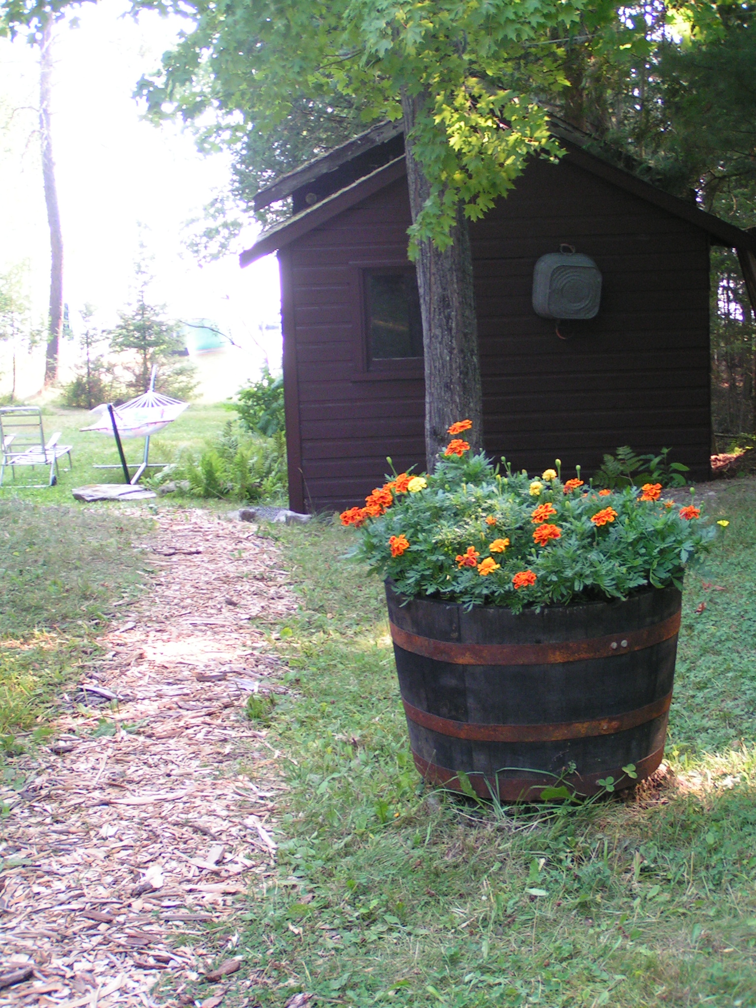 path, flower barrel, sleeping cabin