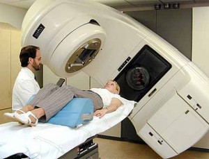 Oncologist providing radiation therapy to a cancer patient. Image provided by Flickr user: Tiptimes