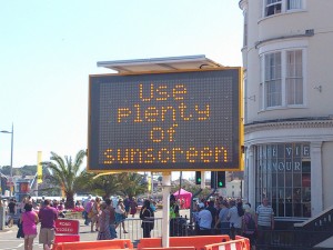 A sign that reminds everyone to 'use plenty of sunscreen' to protect themselves from the harmful rays of the Sun