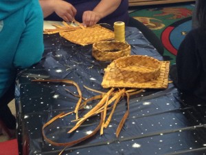 Traditionally woven graduation caps.