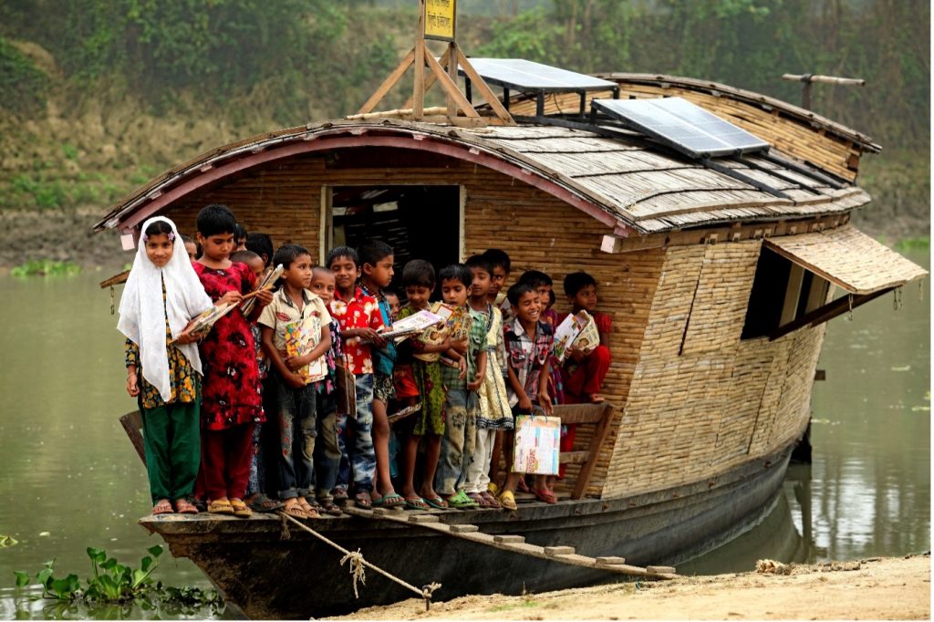 A group of children on the floating school