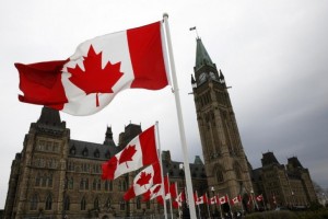 453678-canadian-flags-line-the-road-around-parliament-hill-during-the-nationa