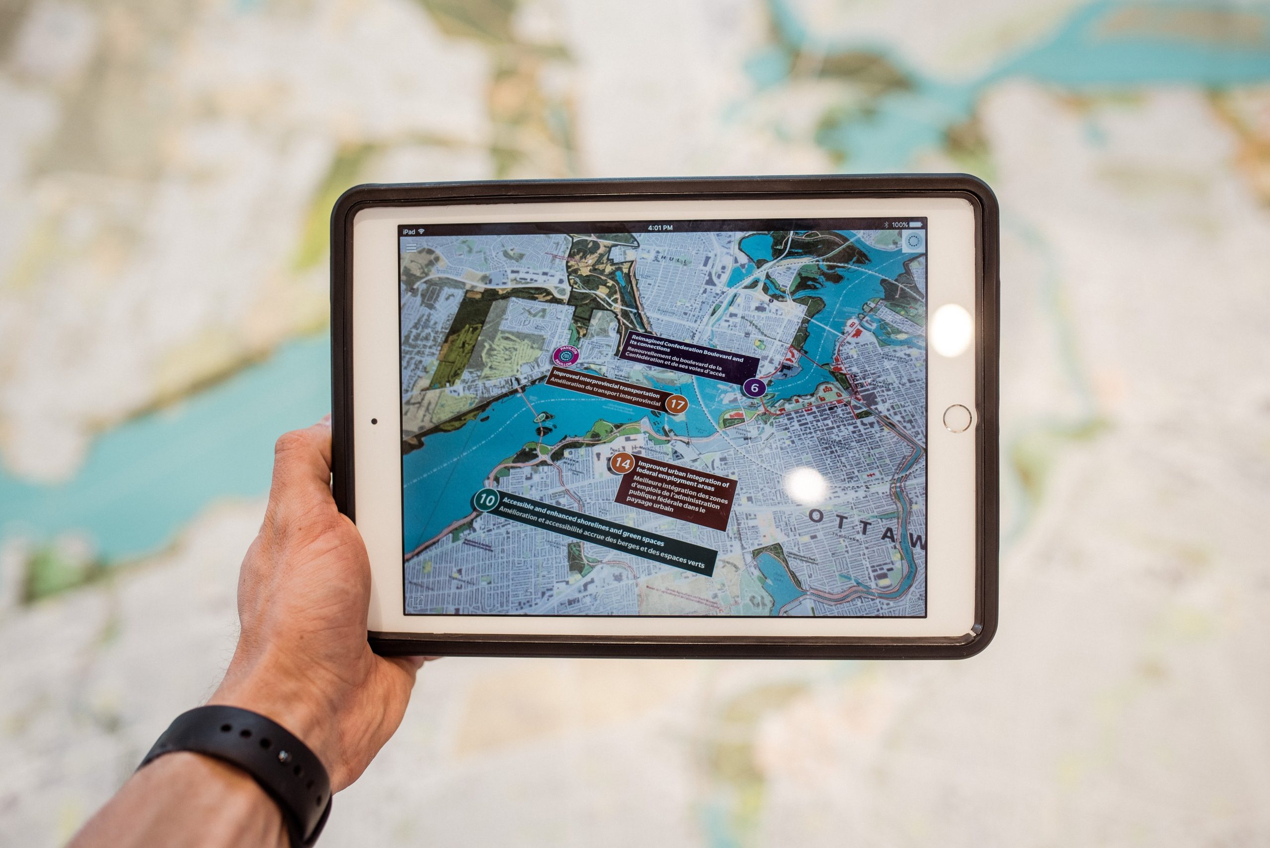Tablet with AR location markers displaying on a map.