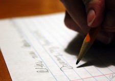picture of hand writing with a pencil