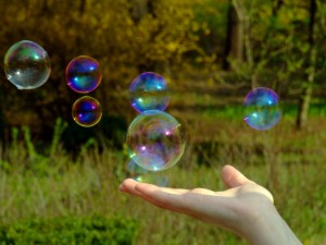 image of hand holding soap bubble