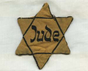 Suitcase; Star of David Badge – Literary Representations of the Holocaust