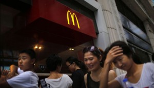 People walk by a McDonald's store in downtown Shanghai