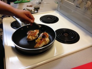 Foods 11 frying chicken for their salad