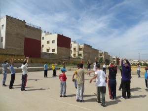 Leading stretches before organizing a soccer game for the neighbourhood kids in Fez, Morocco