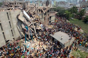 Rescuers work after a building housing several garment factories collapsed in near Dhaka, Bangladesh, on April 24, 2013. After the deadly building collapse, Walmart released a list of factories it had banned. But it has continued receiving shipments from two of those factories
