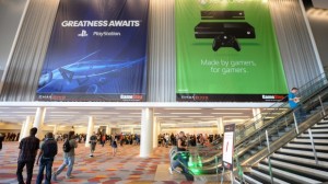 Banners for the Sony PS4 and Xbox One gaming systems hang at the GameStop Expo in Las Vegas in August. The two systems will be commercially available this month.