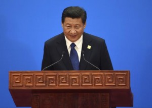 China's President Xi Jinping bows after speaking at a news conference for the APEC Summit at the International Conference Center in Yanqi Lake, north of Beijing
