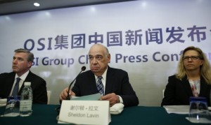 OSI Group Chairman and CEO Lavin, OSI Group President and Chief Operating Officer McDonald and OSI Vice President of North America Quality Birkett attend a news conference in Shanghai