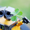 Wall-E offering a clover