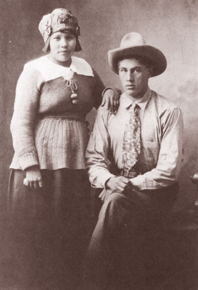 Harry with Margaret Holding who taught him to read and write in English Photo taken in Omak Washington 1922