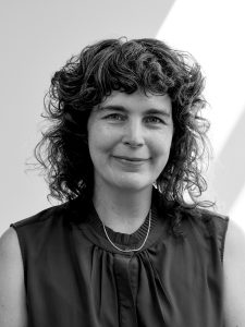 A black and white headshot of Lisa Brunner.