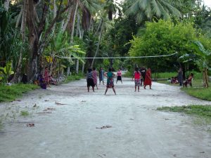 The clean main street of Arno Islet, which doubles as the volleyball court