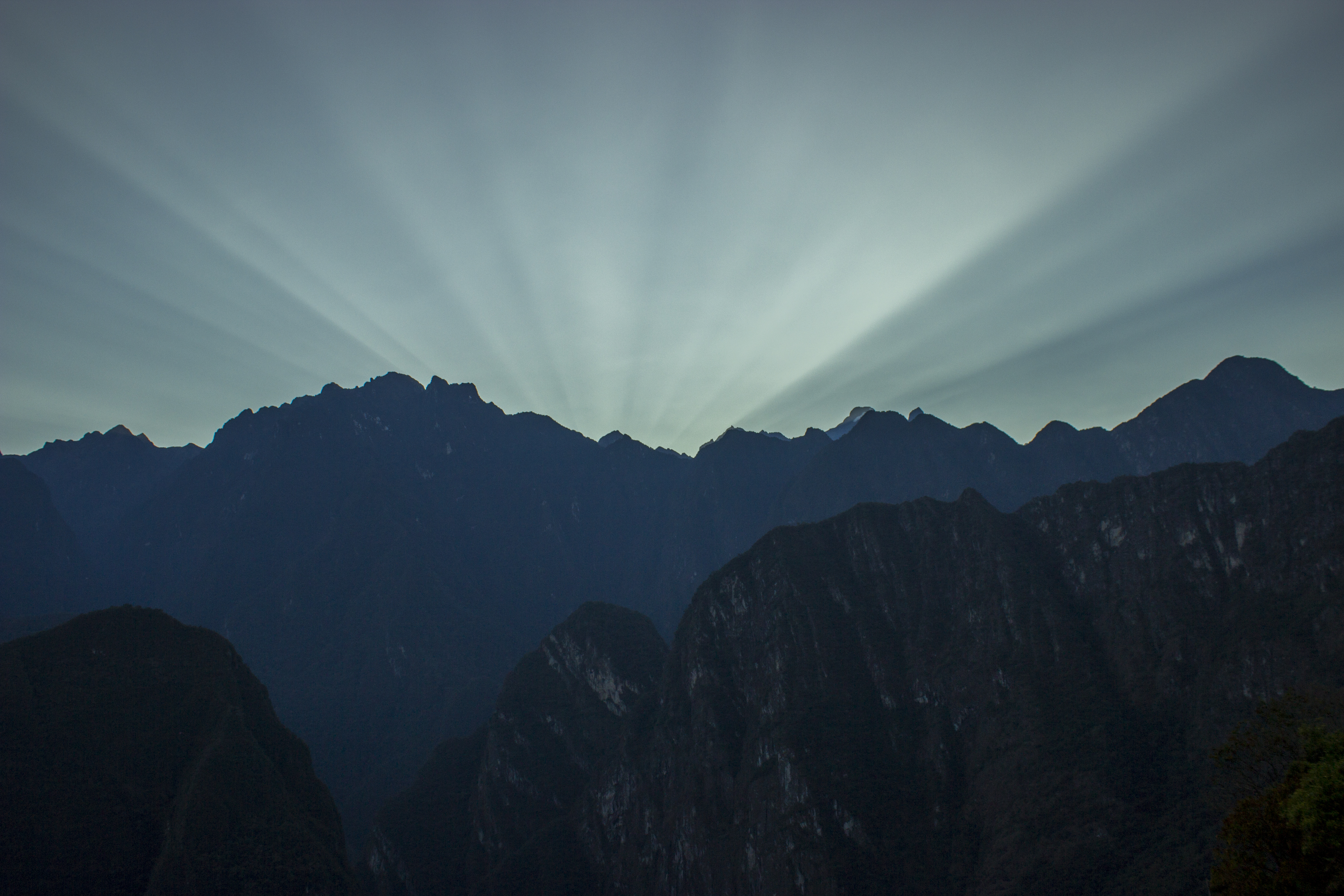 Sun rays over mountains near Machu Picchu