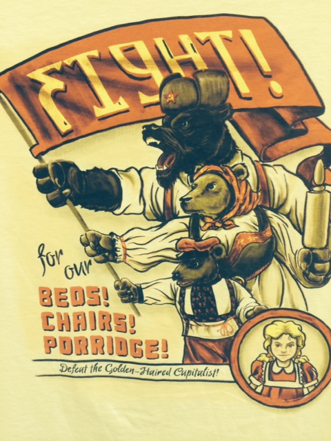 The Golden Haired Capitalist: A t-shirt displayed in a classroom at my practicum school, one of the few visible artifacts prompting a discussion of socio-economic class.