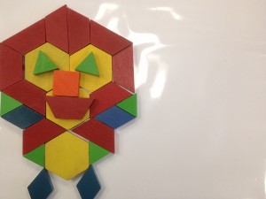 A student used more than 7 tangram pieces to create her own image.