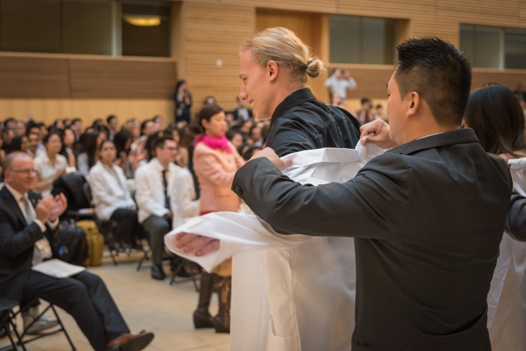 Student receiving white coat at 2015 White Coat Ceremony.