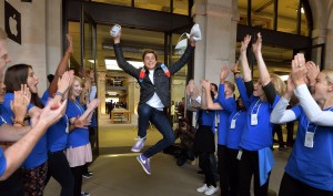 Jesse Green aged 15, from Stanmore jumps for joy as Apple workers applaud him, after being one of the first customers to buy the two new iPhones, at the Apple shop in Covent Garden in central London. PRESS ASSOCIATION Photo. Picture date: Friday September 20, 2013. See PA story TECHNOLOGY Apple. Photo credit should read: John Stillwell/PA Wire